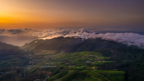 Aerial view of townscape against sky during sunset