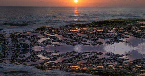 Scenic view of sea against sky during sunset