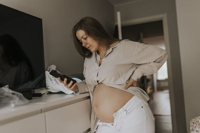 Pregnant woman at home