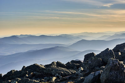 Scenic view of mountains against sky during sunset