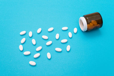 Close-up of blue paint over white background