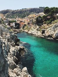 Sea flowing amidst rock formations