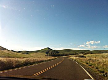 Empty country road along landscape