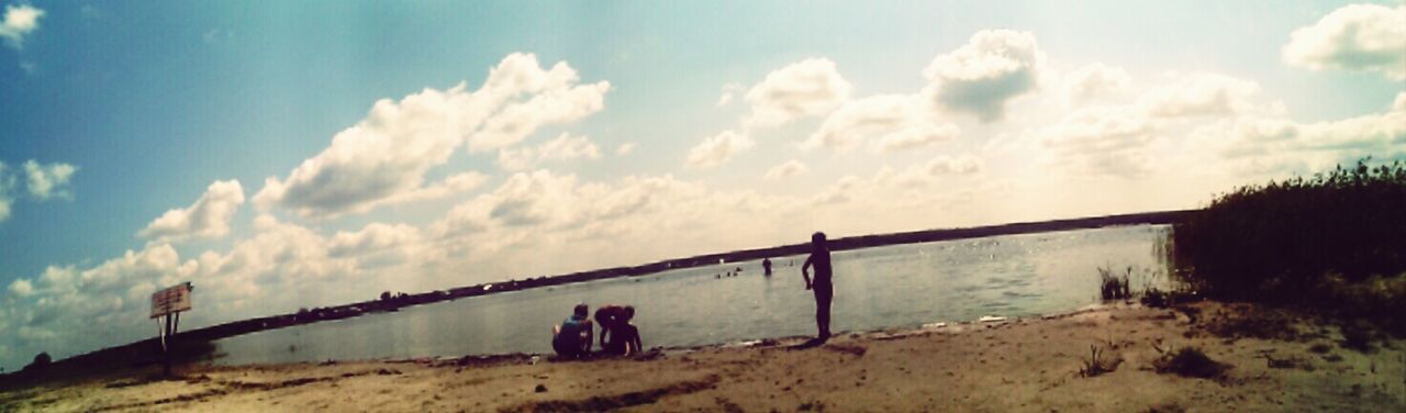 sky, cloud - sky, men, lifestyles, cloudy, leisure activity, cloud, person, nature, standing, tranquility, landscape, day, beauty in nature, tranquil scene, outdoors, water, scenics