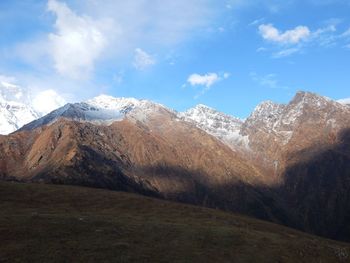 Scenic view of snowcapped mountains against sky