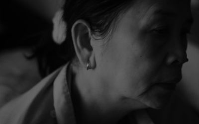 Close-up portrait of young woman looking away