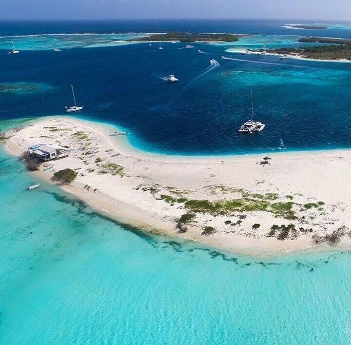 water, sea, scenics, tranquil scene, beach, blue, tranquility, beauty in nature, idyllic, nature, aerial view, ocean, coastline, seascape, vacations, waterfront, shore, non-urban scene, turquoise colored, day, calm, tourism, outdoors, sky, harbor, remote, curve