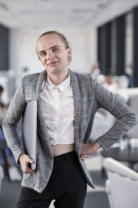 Man in office looking at camera