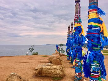 Panoramic view of rocks on beach against sky