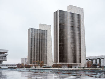 Modern buildings in city against sky