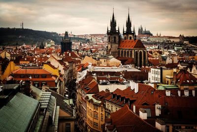 High angle view of town against cloudy sky