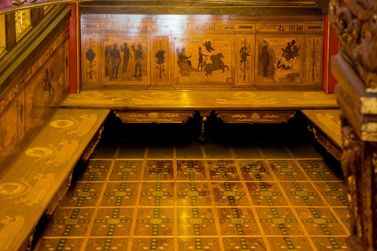 HIGH ANGLE VIEW OF PEOPLE ON TILED FLOOR IN TEMPLE