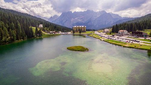 Scenic view of lake and mountains against sky