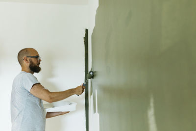 Man painting walls