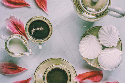 High angle view of white roses on table