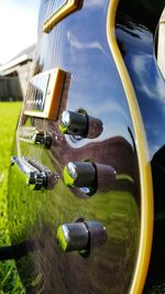 Cars on field against sky