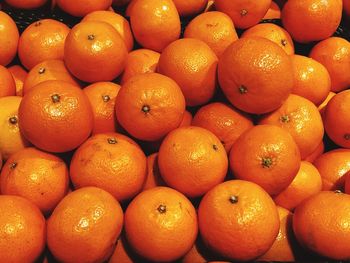 Full frame shot of oranges at market stall