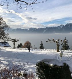 Scenic view of snow covered mountains against sky