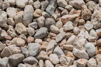 Gravel background texture. close up of little stones on the ground