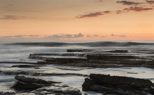 Scenic view of sea against sky during sunset