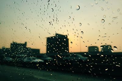 Raindrops on glass window during rainy season