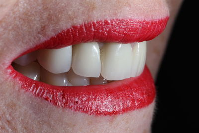 Close-up of woman wearing red lipstick