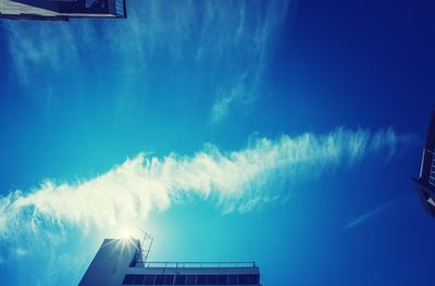 Low angle view of building against blue sky