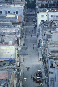 High angle view of people on road against buildings
