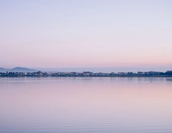 Scenic view of lake against sky during sunset