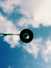 Directly below shot of street light against sky