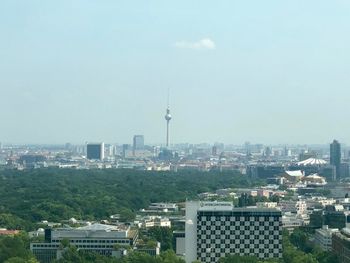 Buildings in city against sky