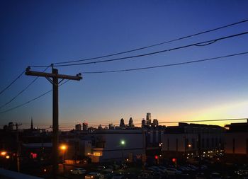 View of illuminated buildings against blue sky