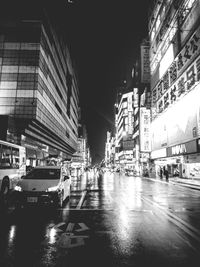 View of illuminated city street at night