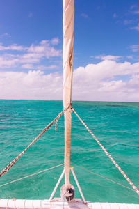 Low angle view of boat in sea against sky