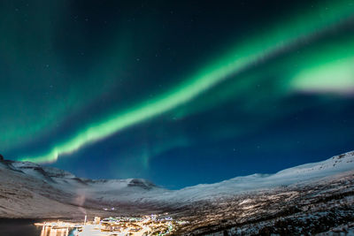 Illuminated village on coast landscape photo