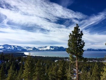 Scenic view of mountains against cloudy sky