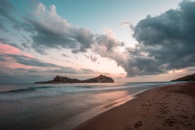 Scenic view of sea against sky at sunset