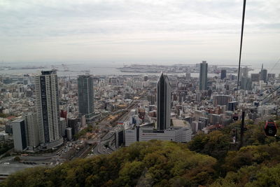 High angle view of modern buildings in city against sky