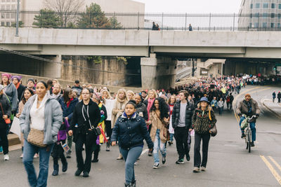 People walking on street in city