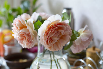 Close-up of rose in vase on table