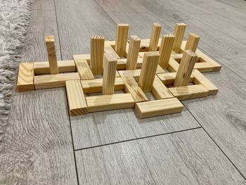 High angle view of wooden blocks arranged on floor