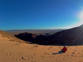 Scenic view of desert against clear sky