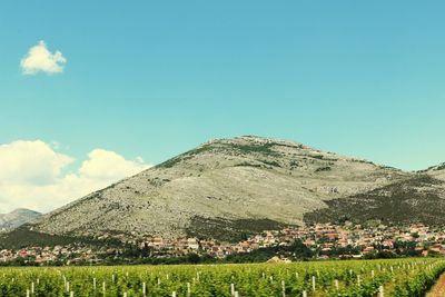 Scenic view of mountains against clear blue sky