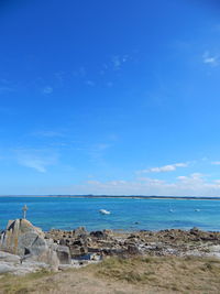 Beach against blue sky