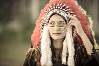 Close-up portrait of woman wearing mask