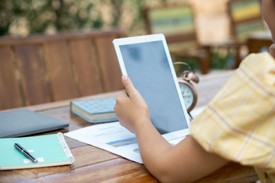 Man using mobile phone on table