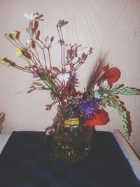 Close-up of flower vase on table at home