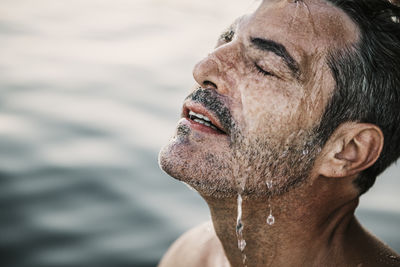 Mature man with wet face