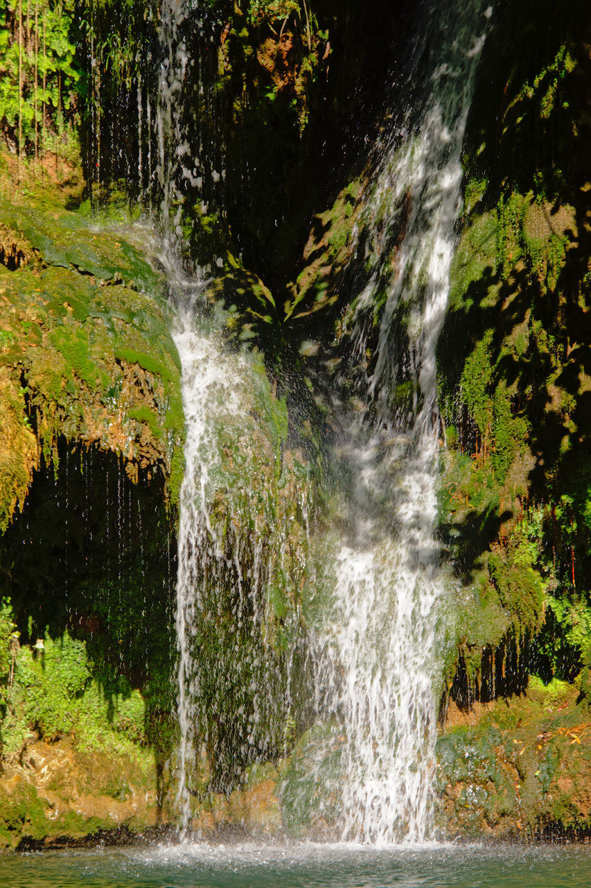 WATER FLOWING THROUGH ROCKS