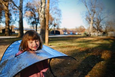 Close-up of smiling girl in park